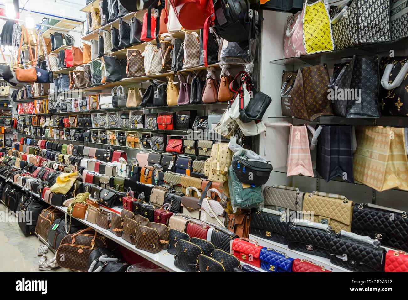 Fake High-end Fashion Brand Name Famous Designer Purses And Backpacks On  Display For Sale At A Local Outdoor Flea Market In Ventimiglia, Italy Stock  Photo, Picture and Royalty Free Image. Image 141103968.