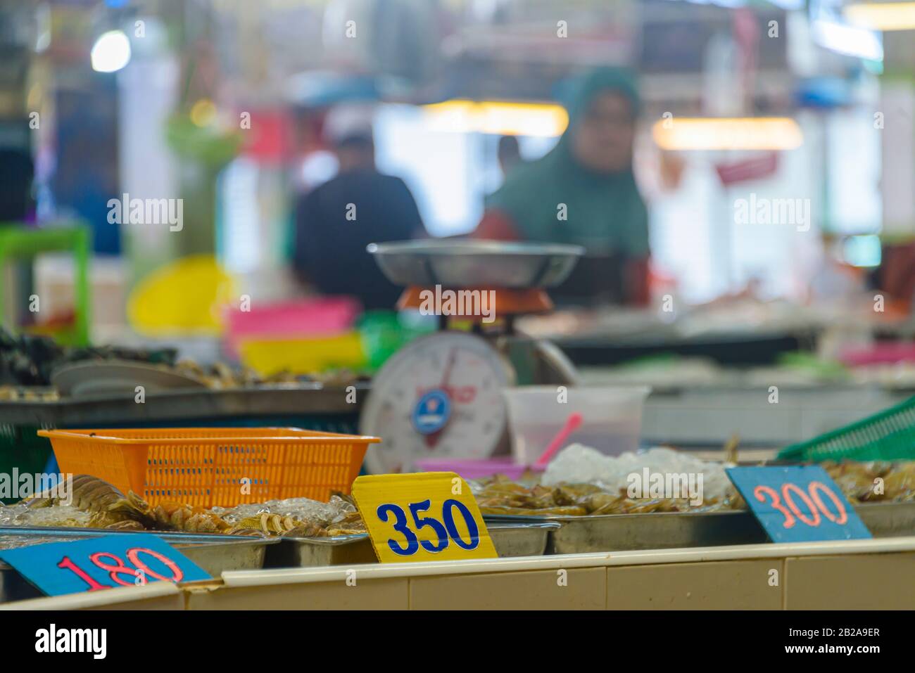 Prices at a seafood fishmonger food market stall, Thailand Stock Photo