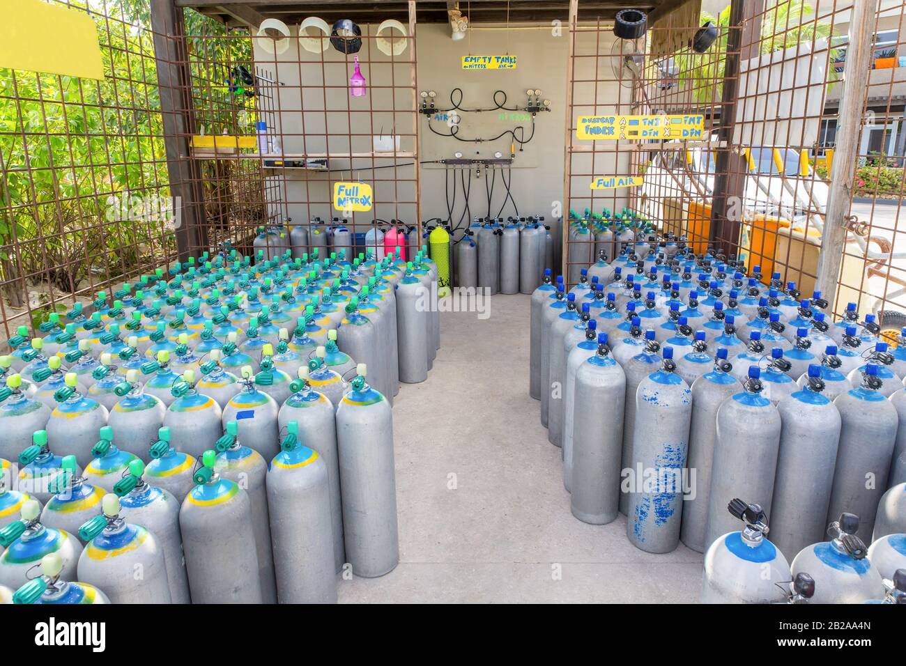 Many oxygen tanks standing in rows as storage  in shed Stock Photo