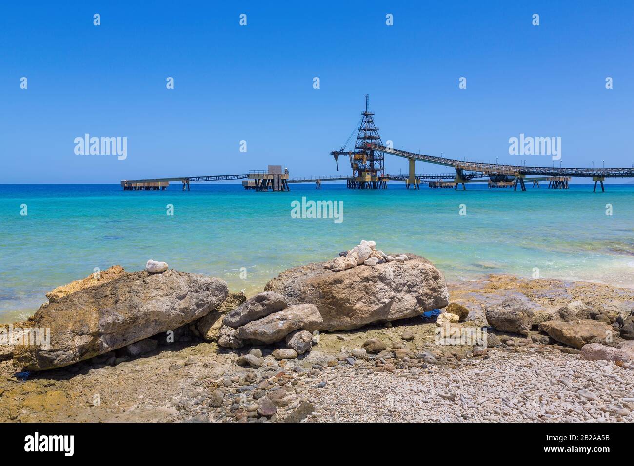 Salt Pier and rocks at sea of island Bonaire Stock Photo