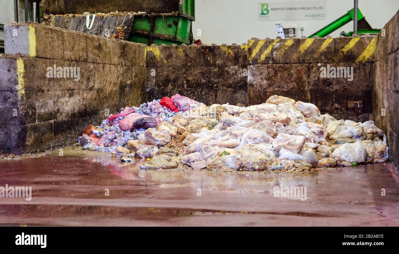 Basingstoke, UK - September 23, 2019: Bags of unused food including sandwiches and loaves of bread waiting to be processed into biofuel at the Herriar Stock Photo