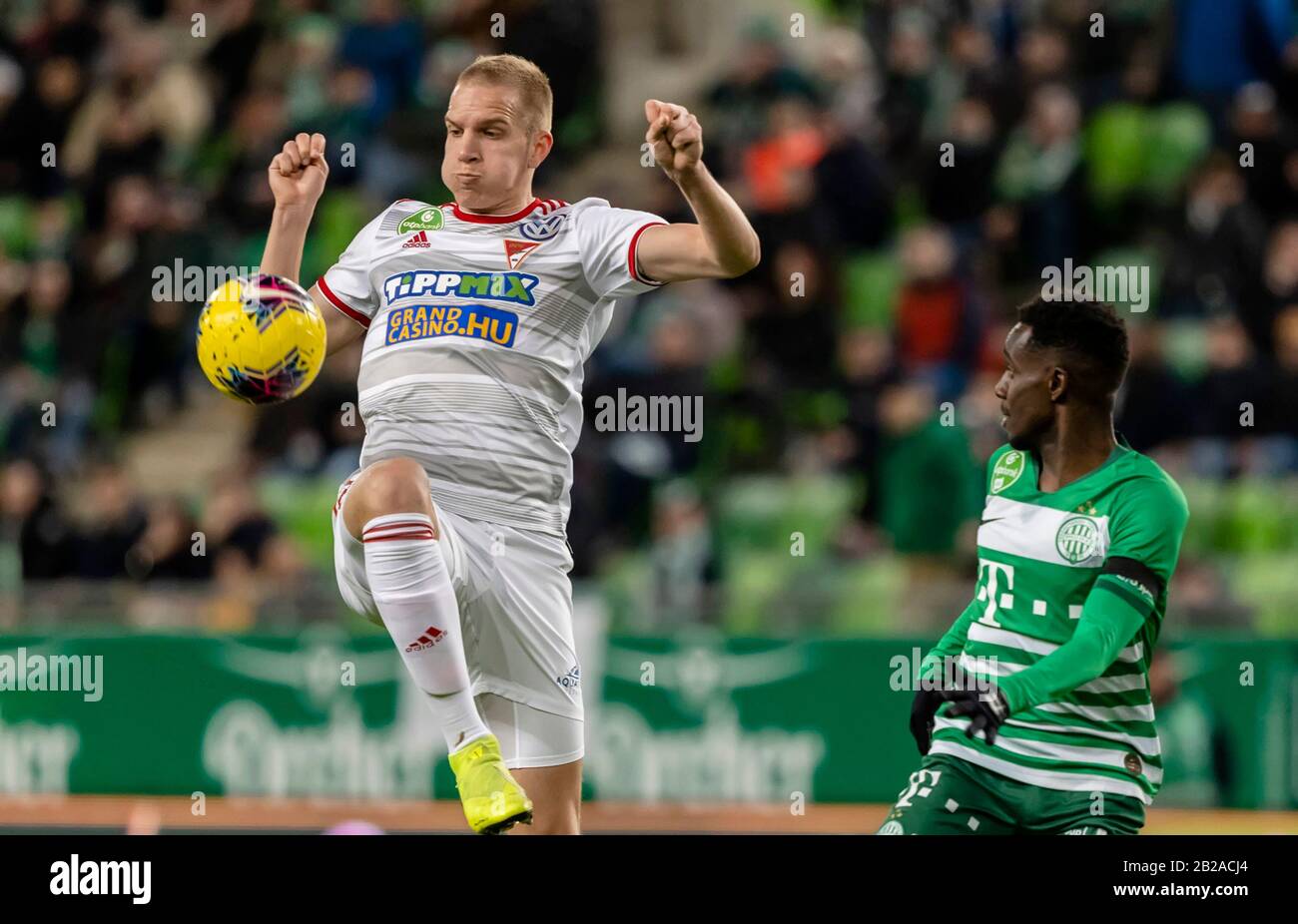 BUDAPEST, HUNGARY - AUGUST 29: (l-r) Tokmac Chol Nguen of Ferencvarosi TC  celebrates his goal in front of Gergo Lovrencsics of Ferencvarosi TC during  the UEFA Europa League Play-off Second Leg match