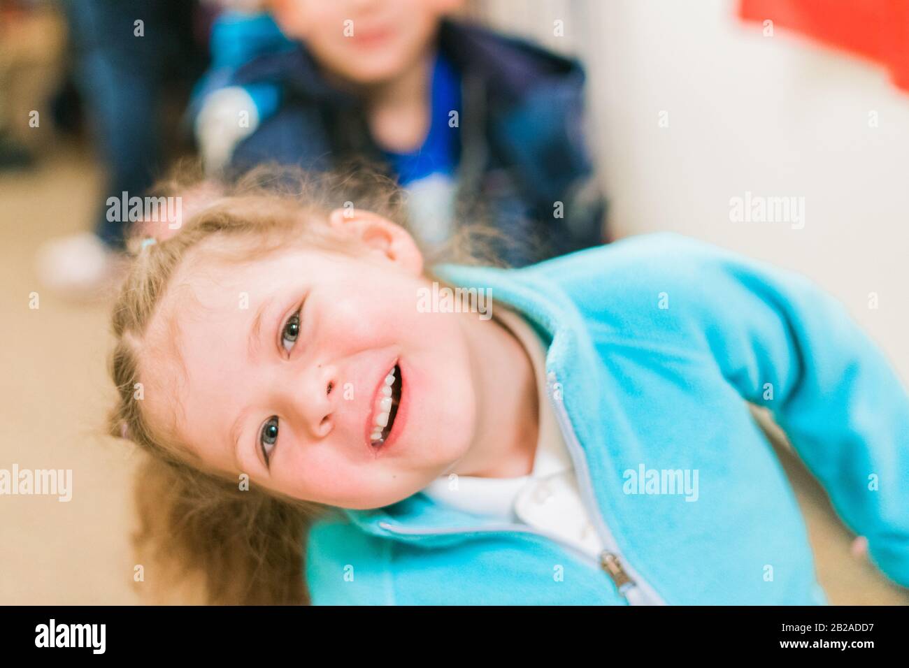 Little girls smiling to the camera Stock Photo - Alamy