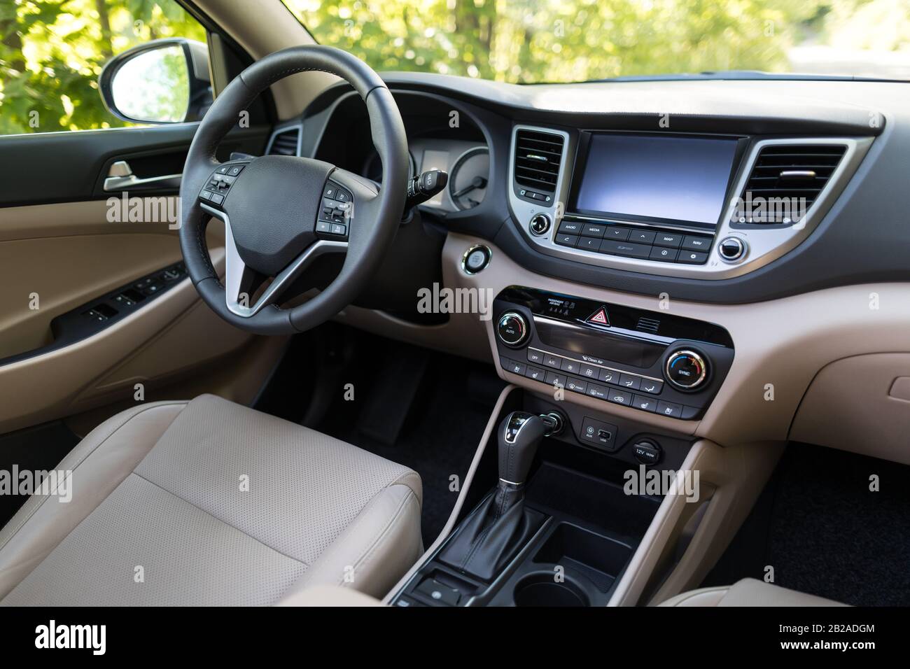 Luxury car interior steering wheel, shift lever and dashboard Stock