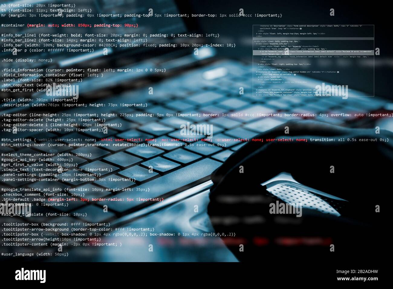 Hacker using laptop. Lots of digits on the computer screen. Stock Photo