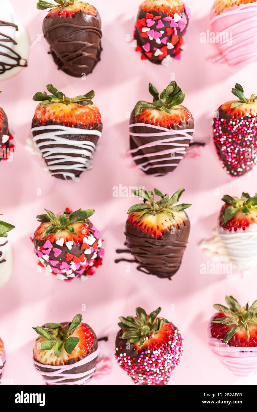 Variety of chocolate dipped strawberries on a pink background Stock ...