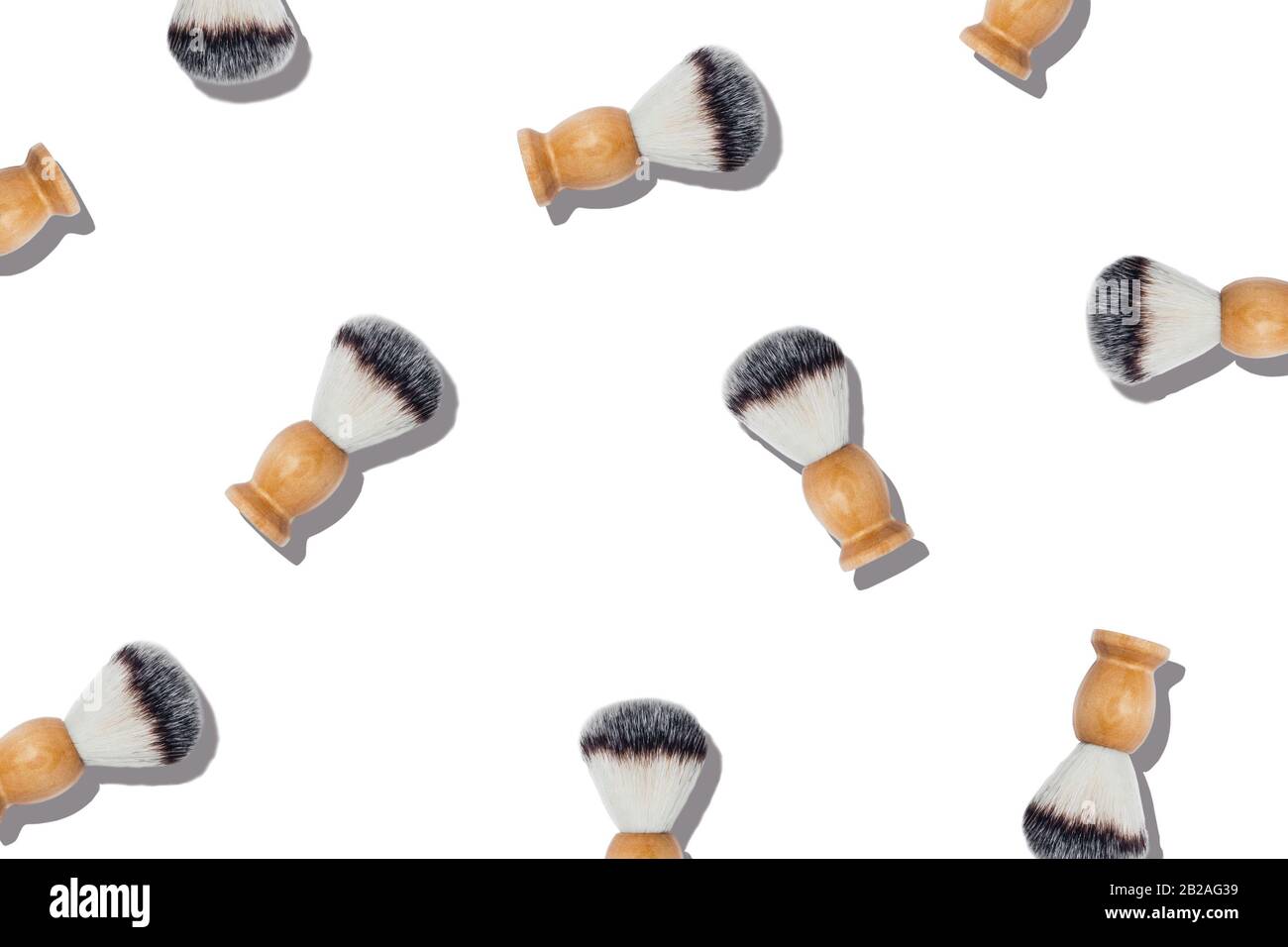 Pattern with shaving brushes on isolated white background. Stock Photo