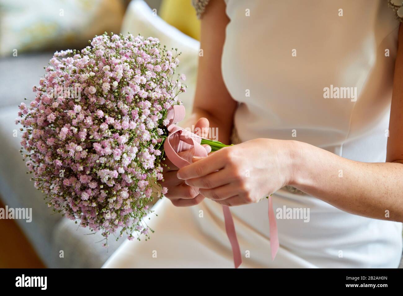 Bride with bouquet of flowers, white wedding dress Stock Photo