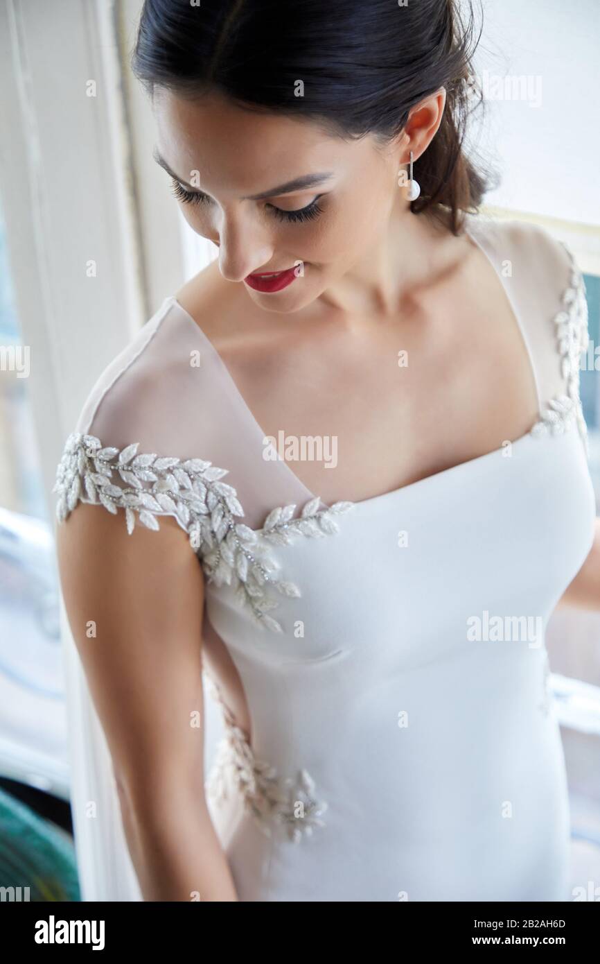 Bride trying on wedding dress in atelier of clothing designer, Bilbao, Spain Stock Photo