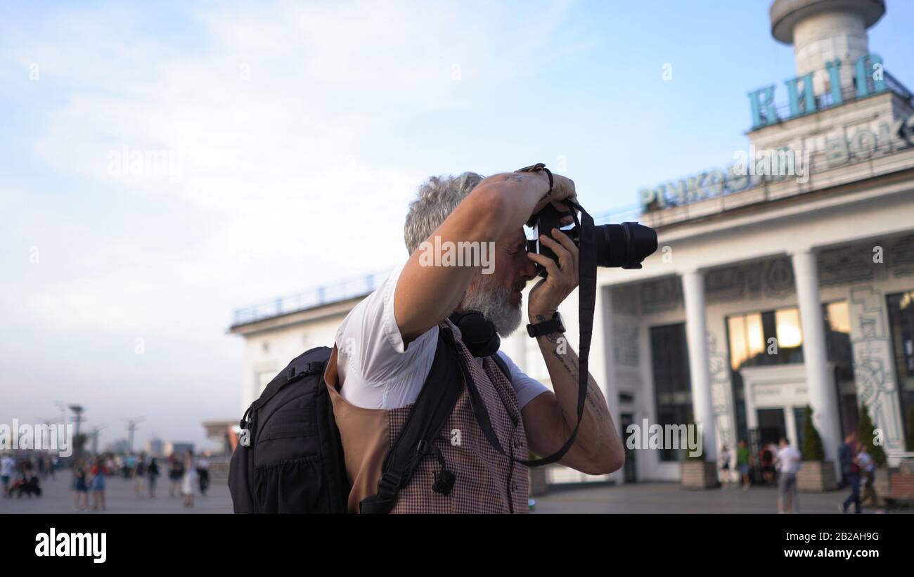 Human Traveler Blogger Makes Shots For His Blog. Stock Photo