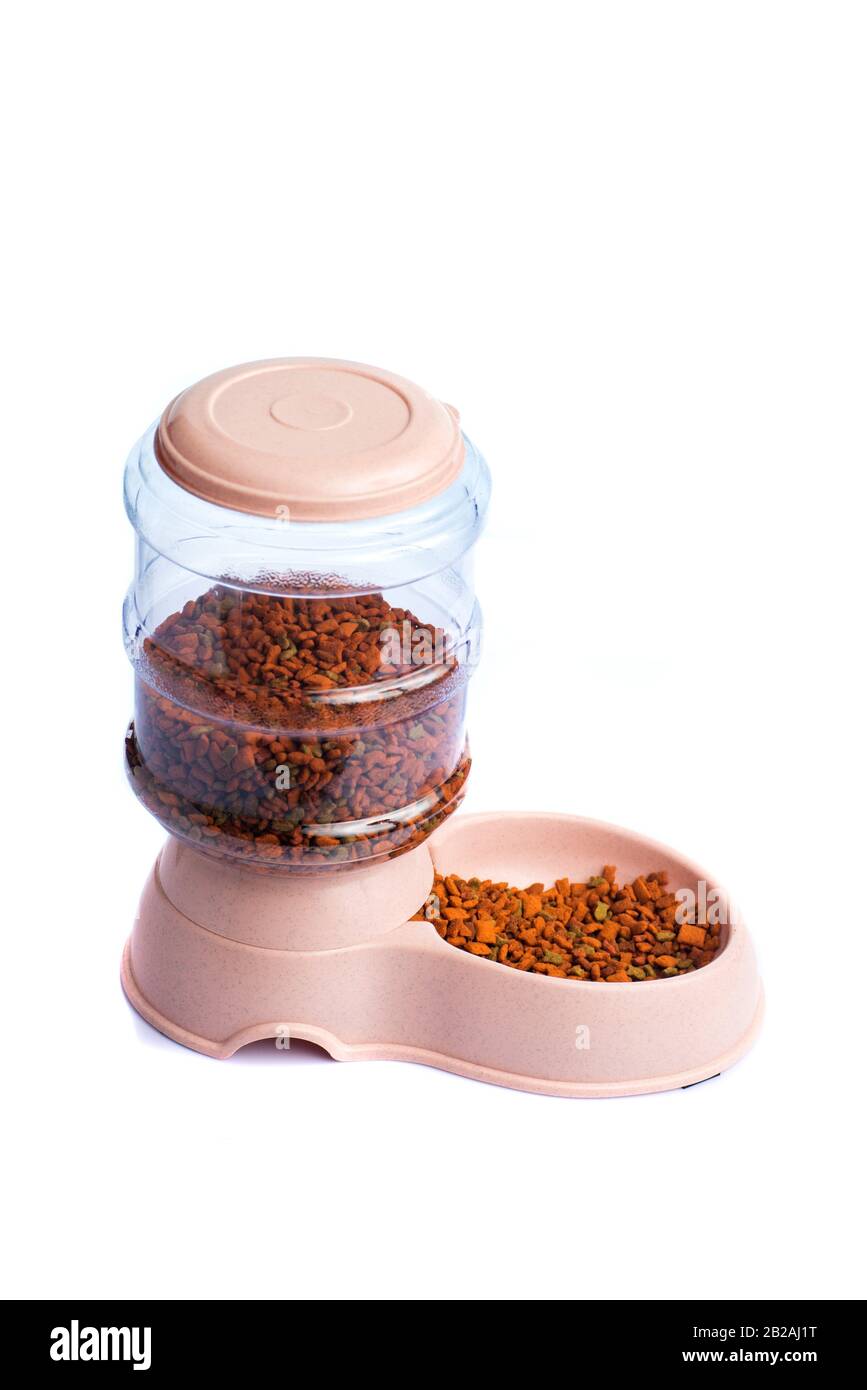 Pet Dry Food Storage Meal Feeder Dispenser or pet food dispenser on a white background Stock
