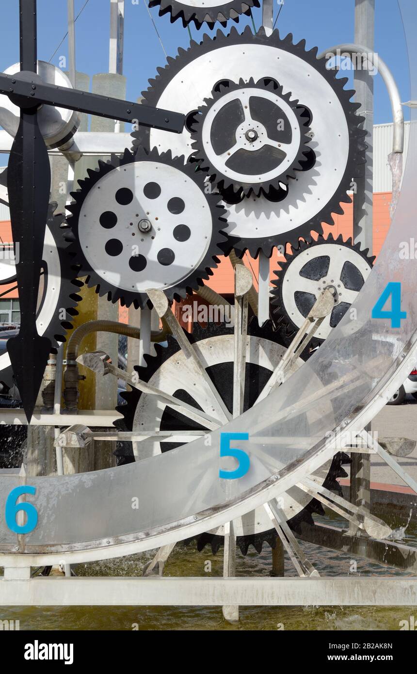 Mechanical Water Clock or Time Piece Contraption Using Flowing Water & Series of Cogs Stock Photo