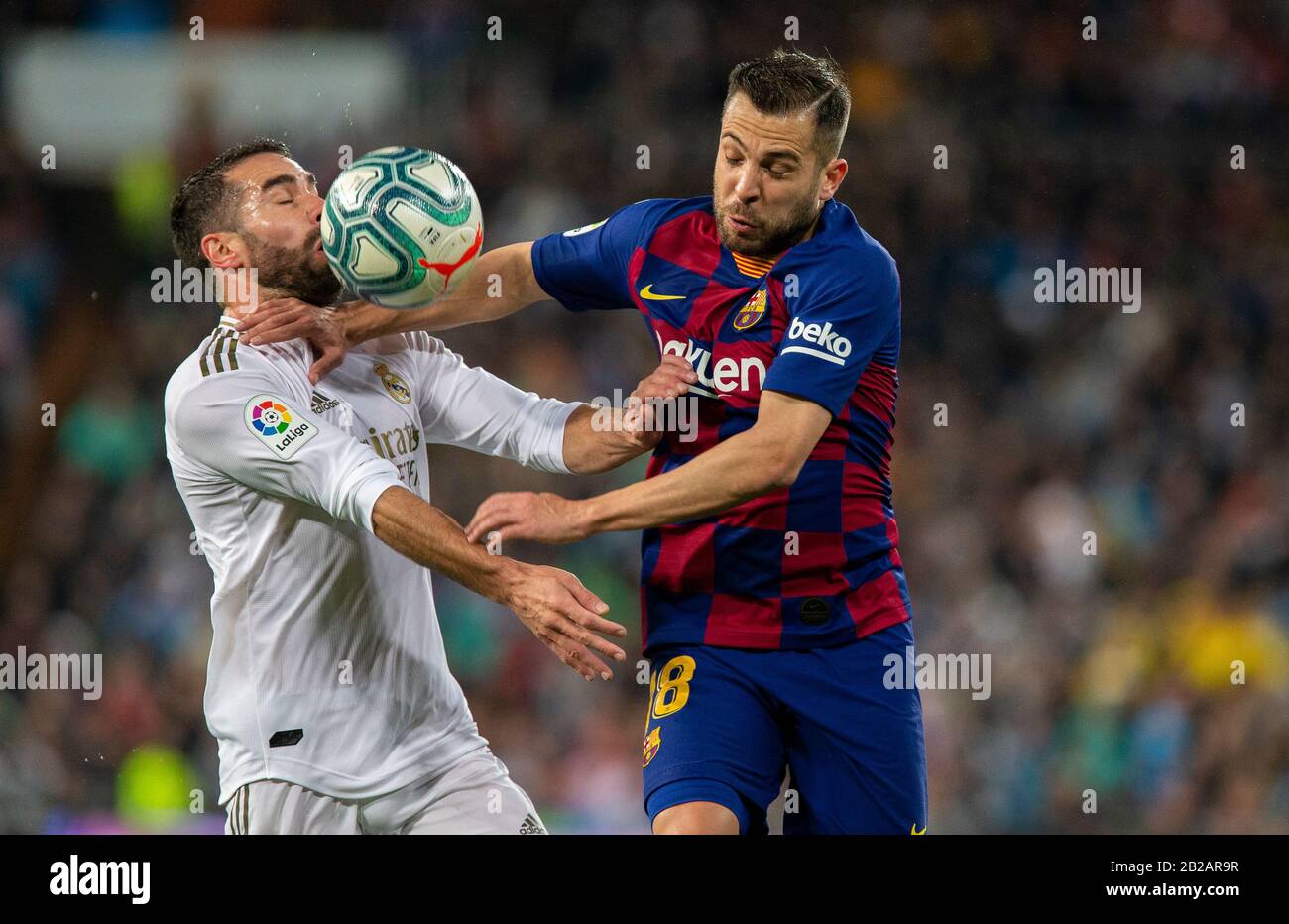 Dani Carvajal (L) and Jordi Alba (R) in action during the Spanish La Liga match round 26 between Real Madrid and FC Barcelona at Santiago Bernabeu Stadium in Madrid.Final score: Real Madrid 2-0 Barcelona. Stock Photo