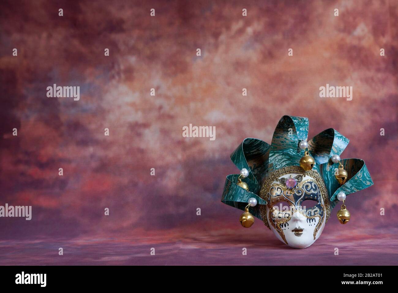 venetian carnival mask on brown fantasy background. Stock Photo