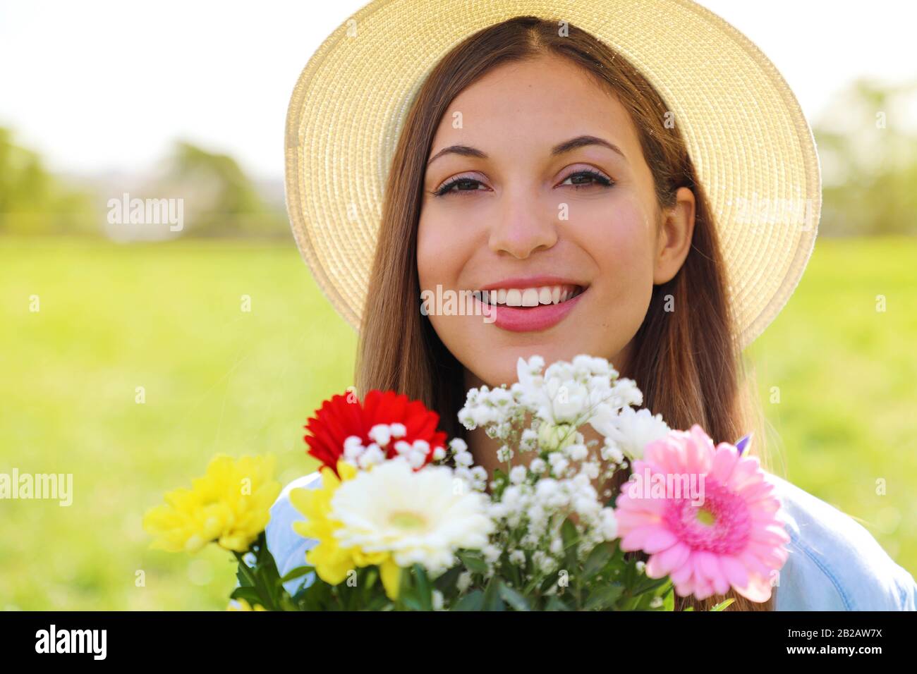 Brazilian young woman receiving bouquet of flowers for the