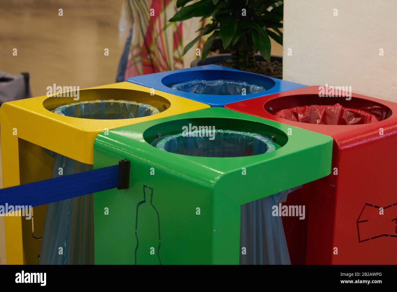 coloured waste containers to indicate the different types of recycling