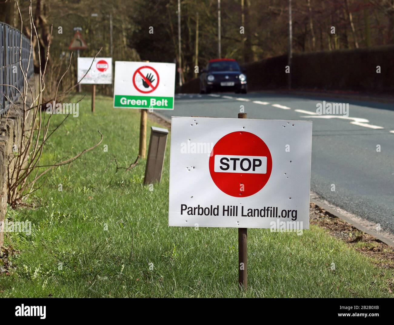 “Stop” protest sign alongside the A5209, Hall Lane at Appley Bridge, Lancashire. There is local concern about tipping at a former land fill site. Stock Photo