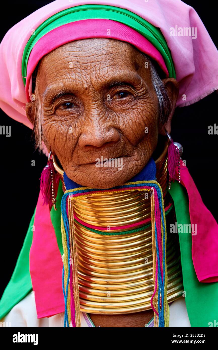 Head portrait of a Kayan Lahwi woman with brass neck coils and traditional clothing. The Long Neck Kayan (also called Padaung in Burmese) are a Stock Photo