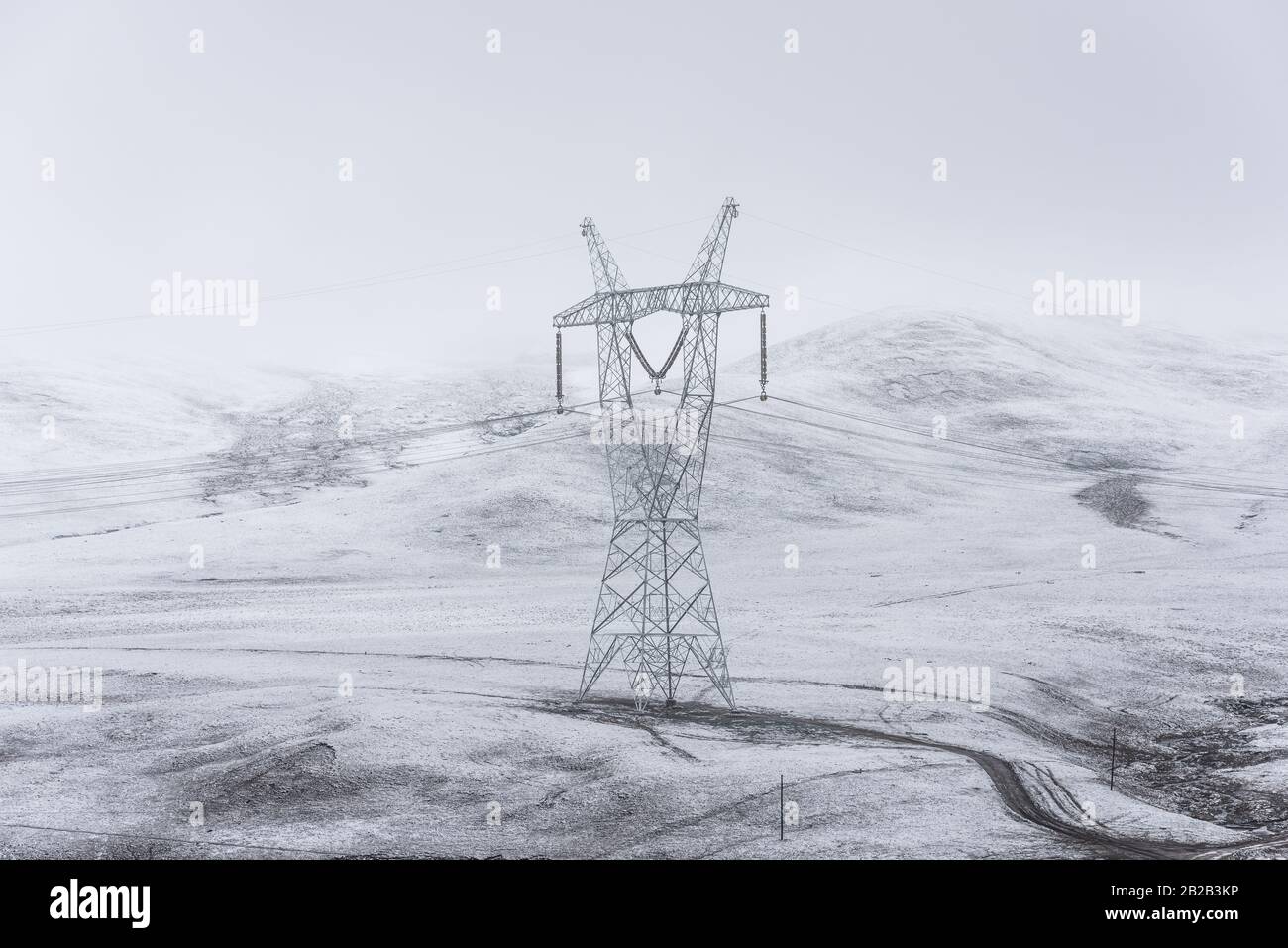 electricity pylon on a mountain which covered with snow Stock Photo - Alamy