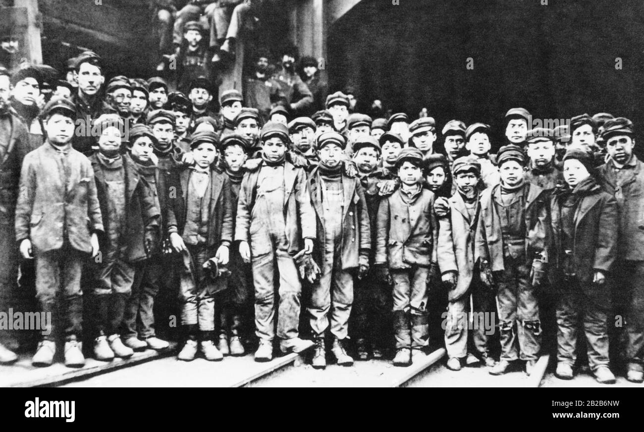 The picture was taken by Lewis Wickes Hine and was commissioned by the National Child Labor Committee. The picture shows many children in working clothes and faces smeared with coal. Stock Photo