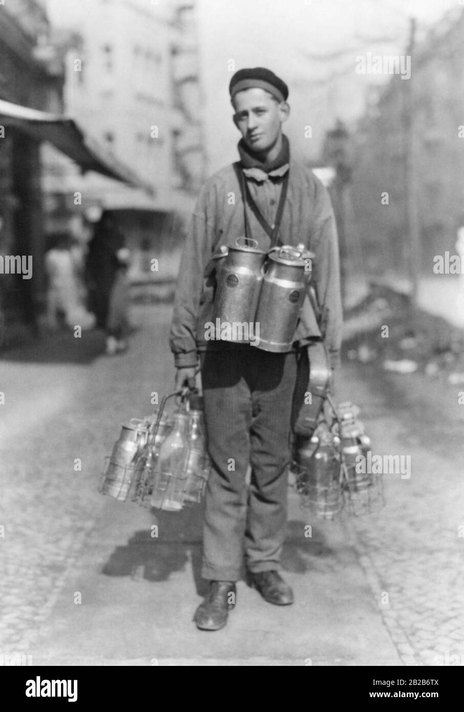 A boy selling milk Stock Photo Alamy