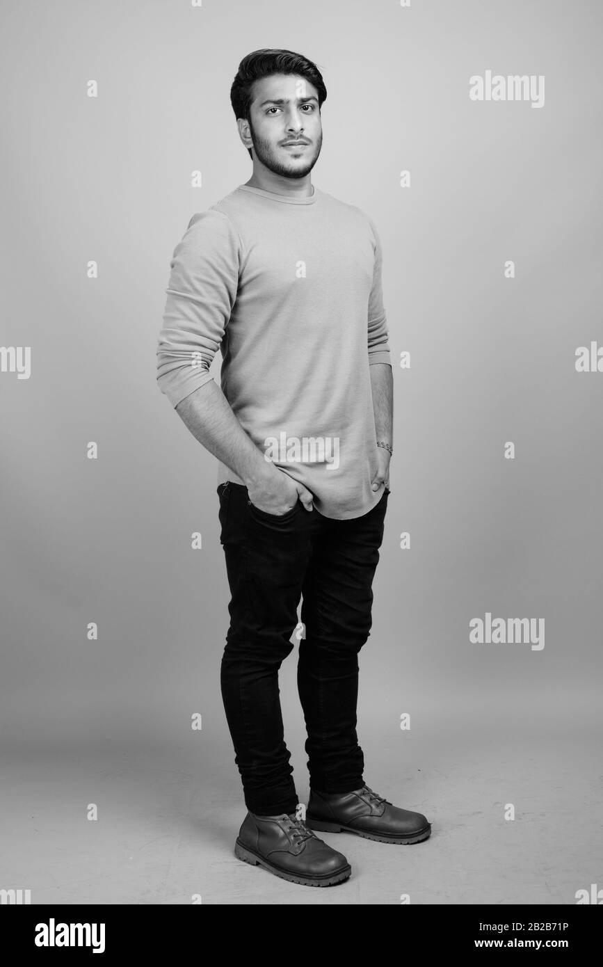 Indian guy full body studio Black and White Stock Photos & Images - Alamy