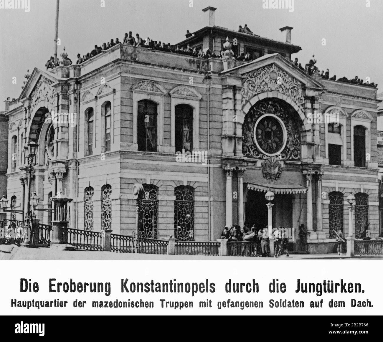 Headquarters of the Macedonian troops with captured soldiers on the roof. The 'Committee for Unity and Progress' forced the reinstatement of the 1876 Constitution and the assembly of the parliament. They also replaced Sultan Abdul Hamid II with his brother Mehmed V. Stock Photo