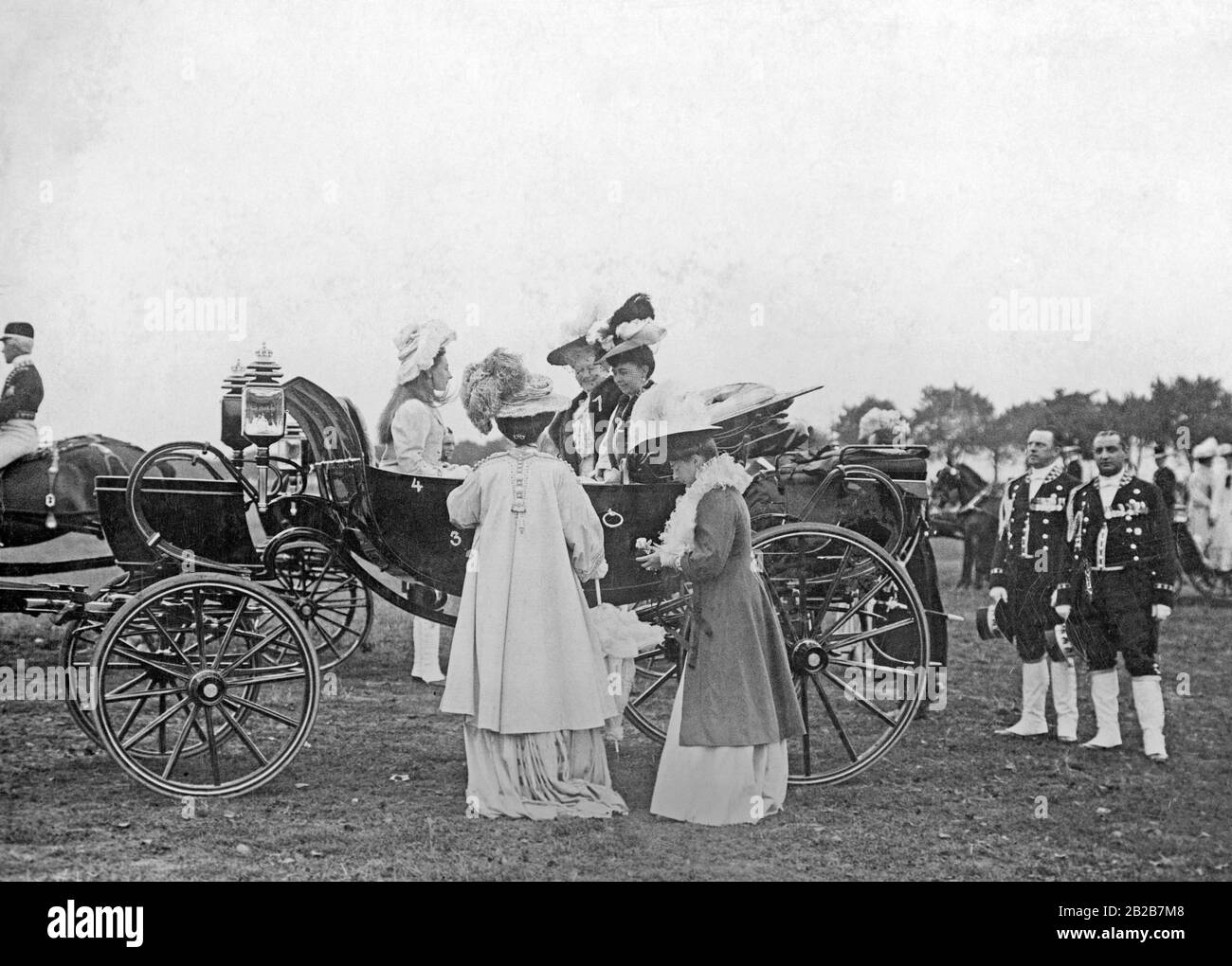 The big parades on the Tempelhofer Feld in Berlin were important social occasions in spring and autumn, at which the high nobility was also present. Here from left to right: Princess Victoria Louise, Crown Princess Cecilie, Empress Augusta Victoria and Crown Princess Sophie of Greece. Stock Photo