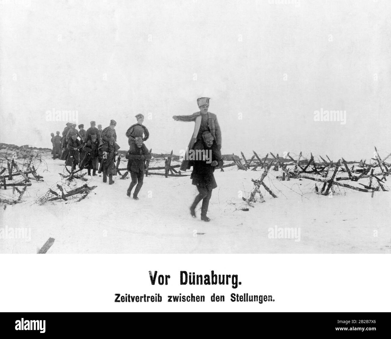 After the armistice, contacts between Germans and RUssians came up at the front. In the picture, there are Russian soldiers killing time at play. Stock Photo