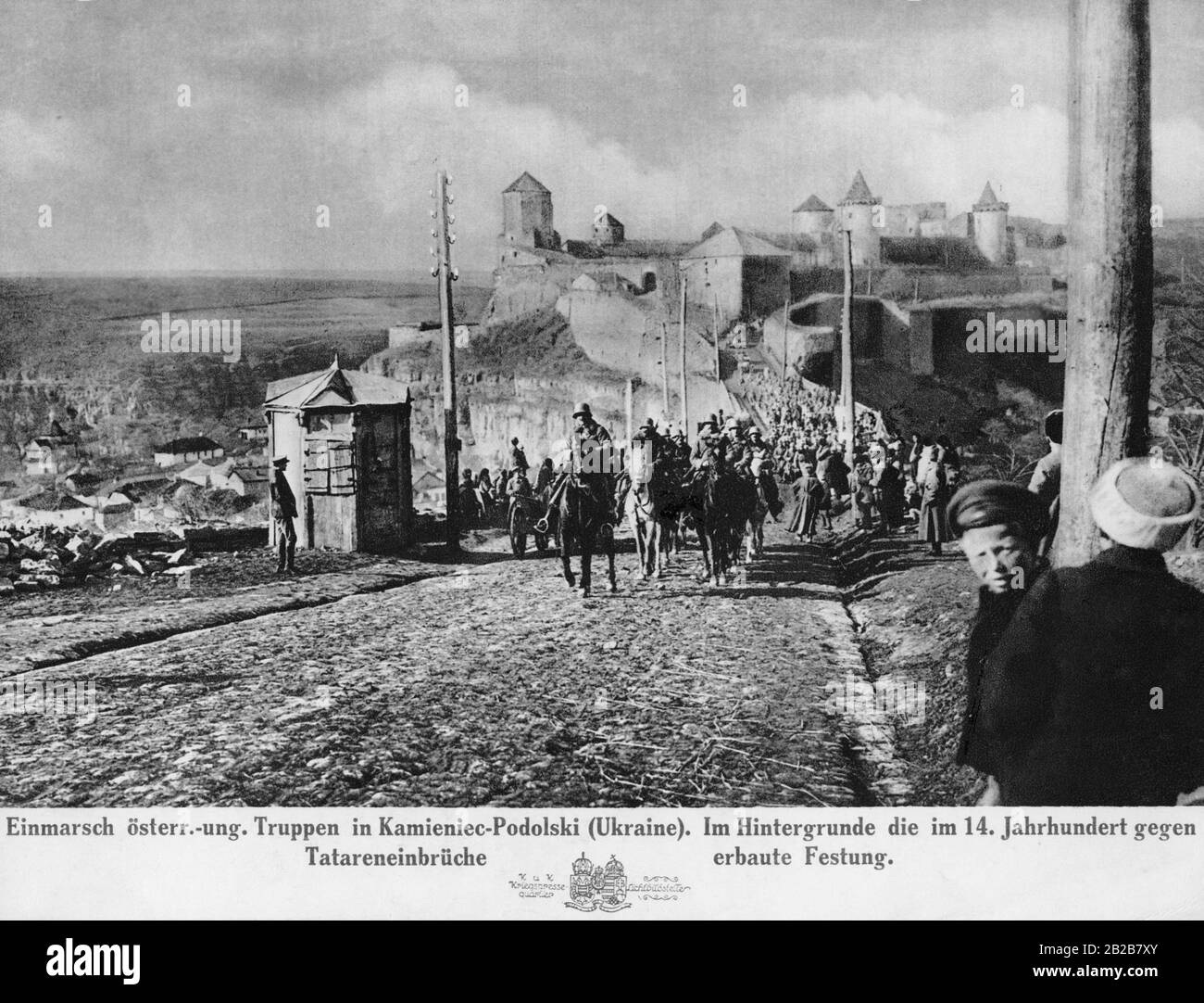 After Leon Trotsky refused to sign the German peace treaty for the end of World War I, German and Austrian troops march into the Ukrainian city of Kamieniec-Podolski to force Ukraine to agree to the peace treaty. In the background is the fortress built in the 14th century to protect the region from the Tatars. Stock Photo