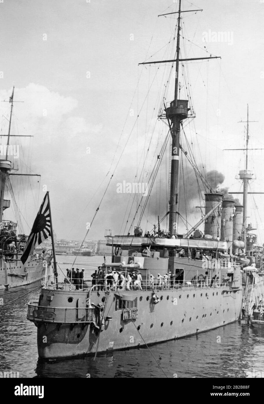 The two training ships of the Japanese Navy Iwate and Iduzmo. At the bow of one of the two ships the flag of the Imperial Japanese Navy is blowing. Stock Photo