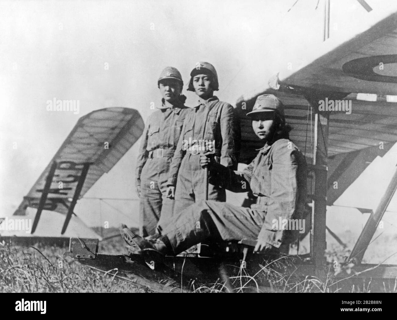 Three young women in Japan during their glider training at an airfield