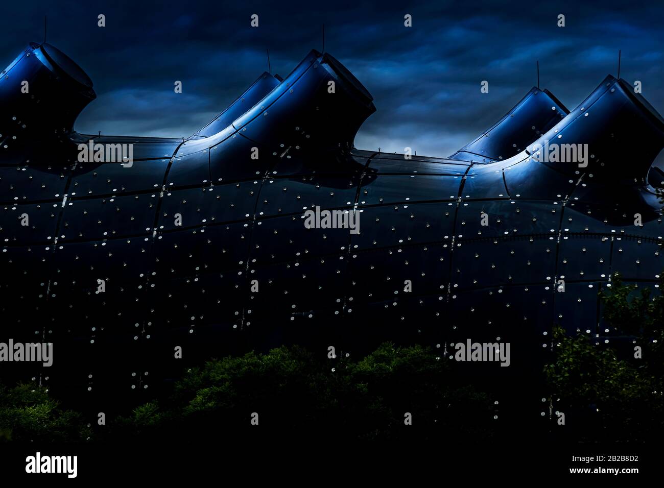 Graz/Austria - August 2019: Glass roof of the Kunsthaus in Graz; Friendly Alien; dark blue toned Stock Photo