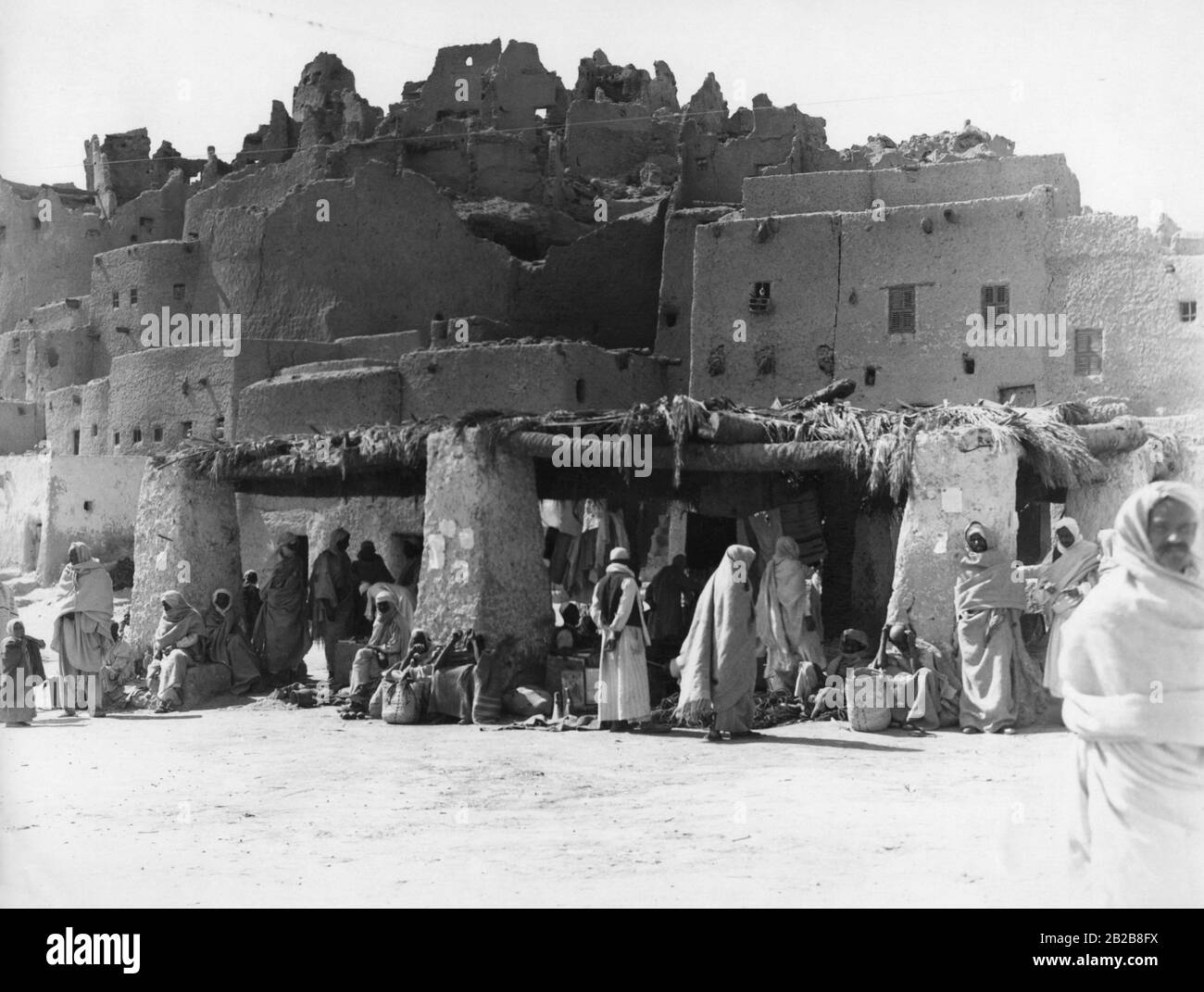 Market in front of the ruins of a ruined castle that once belonged to a powerful Berber sultan. Stock Photo