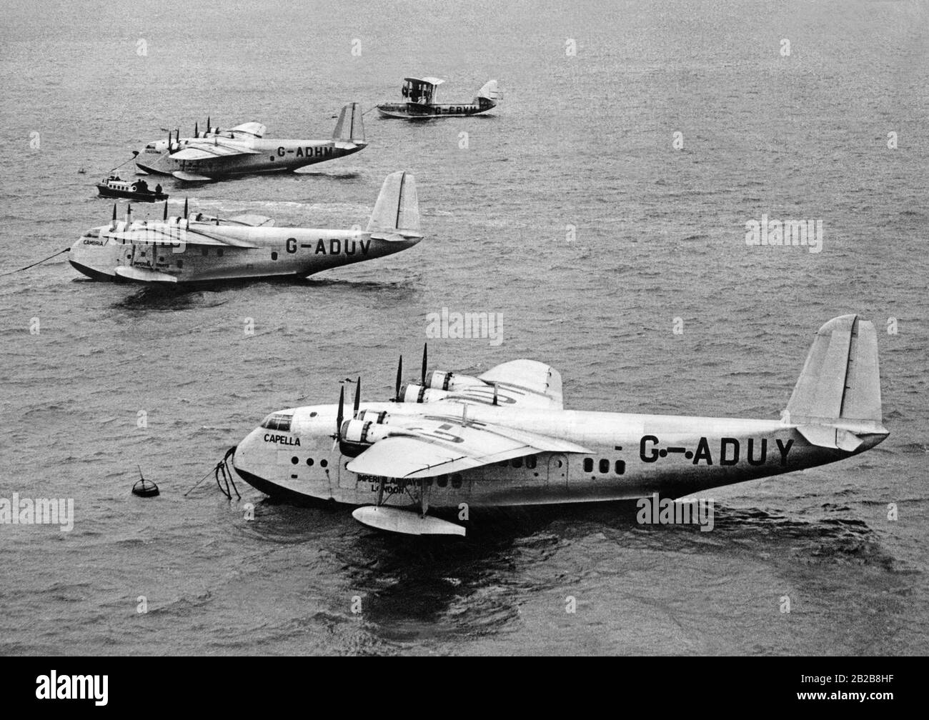 Flying boats of the type Short Empire at anchor. The two flying boats 'Cambria' and 'Caledonia' in the middle are equipped with additional tanks in order to be able to fly long distances. Stock Photo