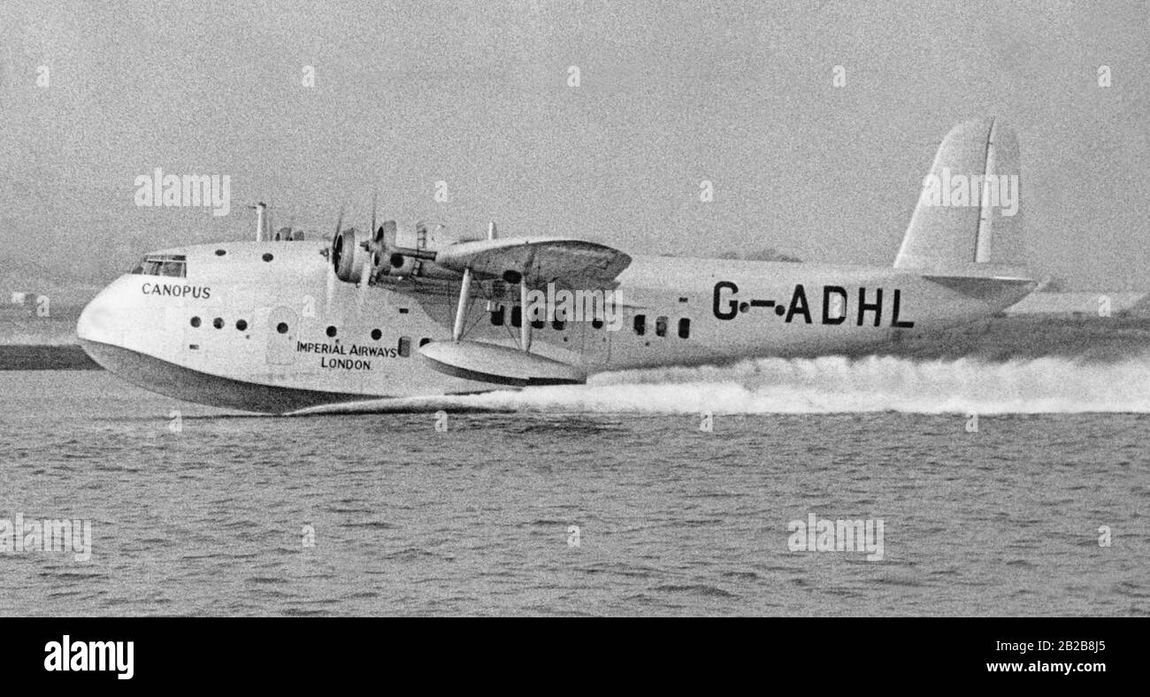 The prototype of the flying boat Short Empire, the 'Canopus' with the registration number G-ADHL, leaves the Short factory in Rochester on its delivery flight to British Imperial Airways. Stock Photo