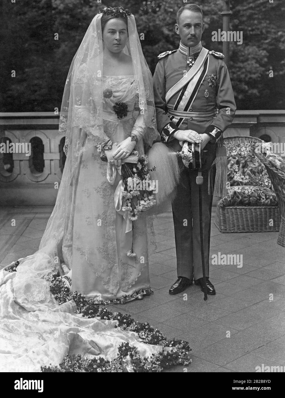 The photo shows the noble bridal couple on their wedding day on May 17, 1913 in the New Palace in Potsdam. The bride and groom are Heinrich XXXIII Reuss zu Koestritz, an imperial German embassy secretary and cavalry captain of the Prussian Army as well as Lieutenant and Princess Victoria Margaret of Prussia. After Victoria's death in 1923, Heinrich will marry Allene Tew, born in the USA, in Paris in 1929. Stock Photo