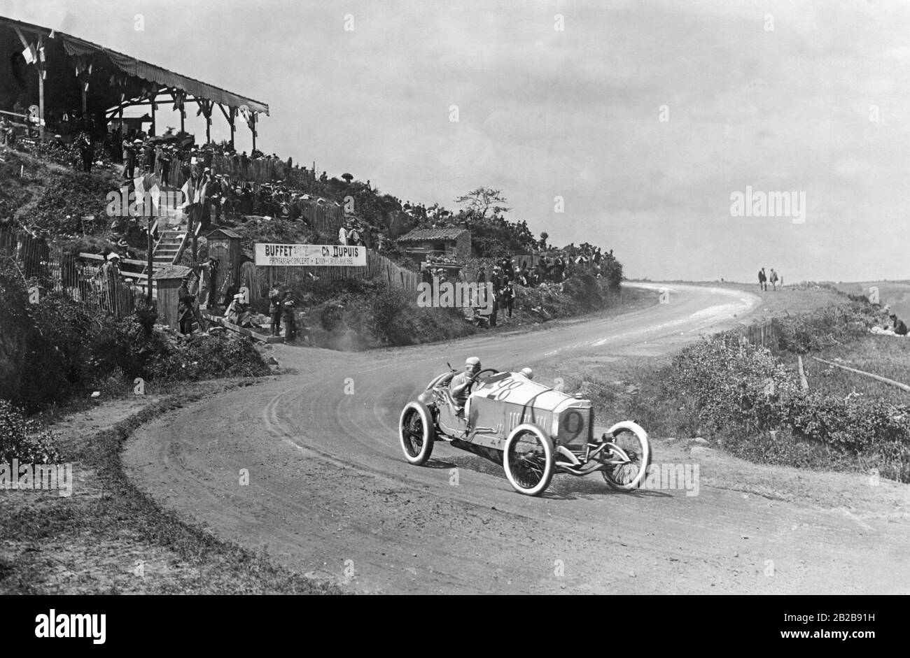 Christian Lautenschlager with his co-driver Hans Rieger in the Mercedes racing car with the number 28 at the French Grand Prix in Lyon. He took 1st place in this race in front of two other Mercedes racing cars. Stock Photo