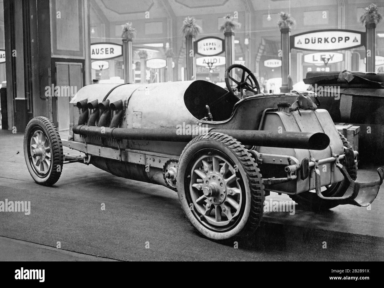 The Benz 200 PS, called 'Blitzen-Benz' or 'Lightning Benz', from 1909 was the fastest pre-war car with a speed of 228 km/h. Here it is on display at the Allgemeine Deutsche Automobil-Ausstellung (now IAA - International Motor Show Germany), in Berlin on the Kaiserdamm in 1926. The aerodynamic rear section has been removed to reveal the tank. Inside the car is the hand pump for the fuel, which had to be operated by the passenger. Stock Photo