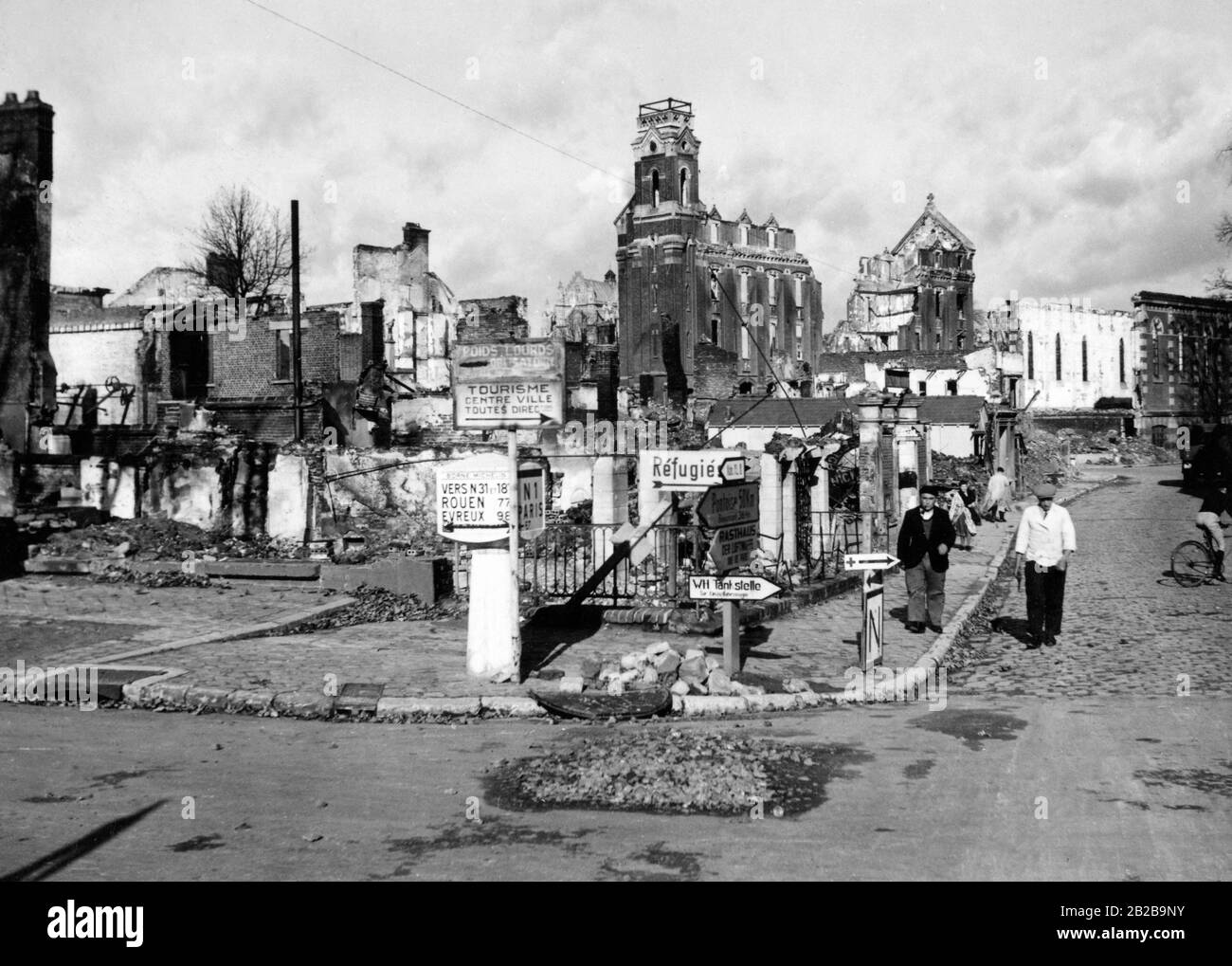 View of a row of houses and a church destroyed in the fights during the French campaign in a village north of Paris on the N1. Photo: Wolff Stock Photo