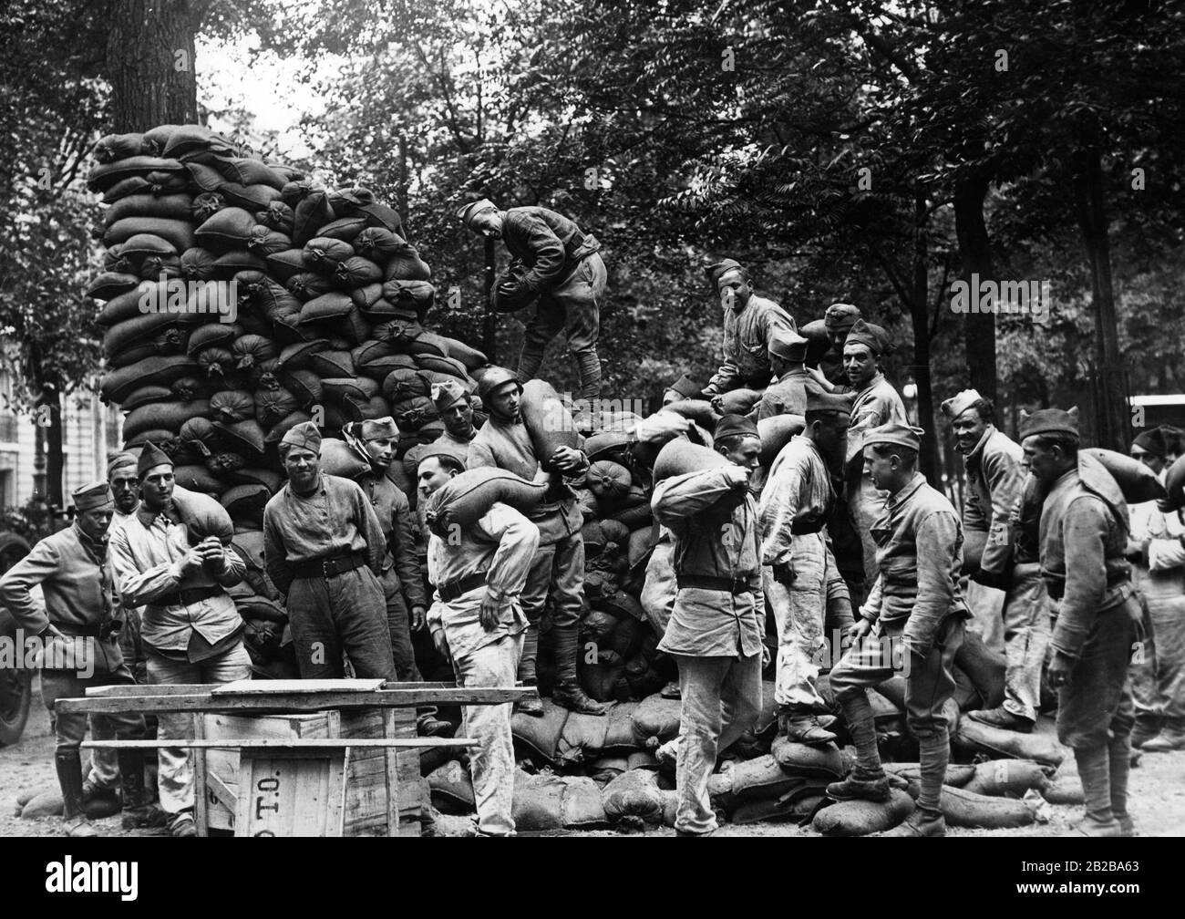 Soldiers build a protective wall of sandbags as part of the 'Exhibition of Security', which is scheduled to open in Paris on June 16, 1939 in front of the Dome des Invalides of Edouard Daladier. Stock Photo