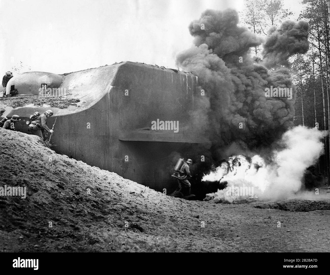 German soldiers fighting at a Maginot Line bunker. It is probably an exercise. Stock Photo