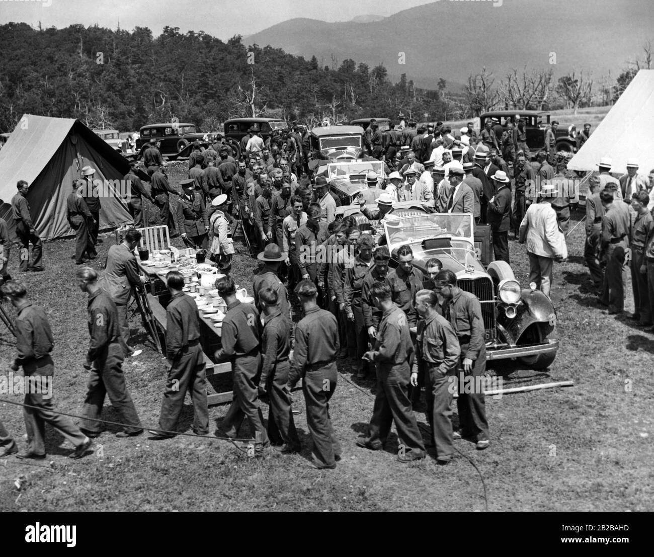 President Franklin Roosevelt greets workers at a Civilian Conservation Corps (A work relief program) camp. Stock Photo