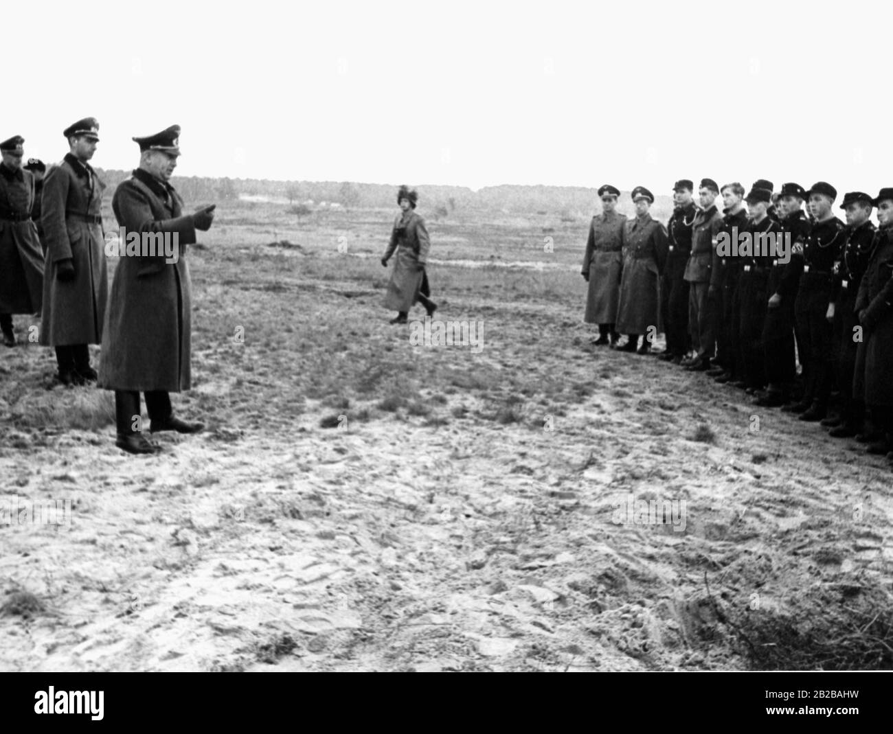 Colonel Walter Gorn, awarded with the Oakleaves with Swords to the Knight's Cross of the Iron Cross, speaks to a group of officer candidates. Stock Photo