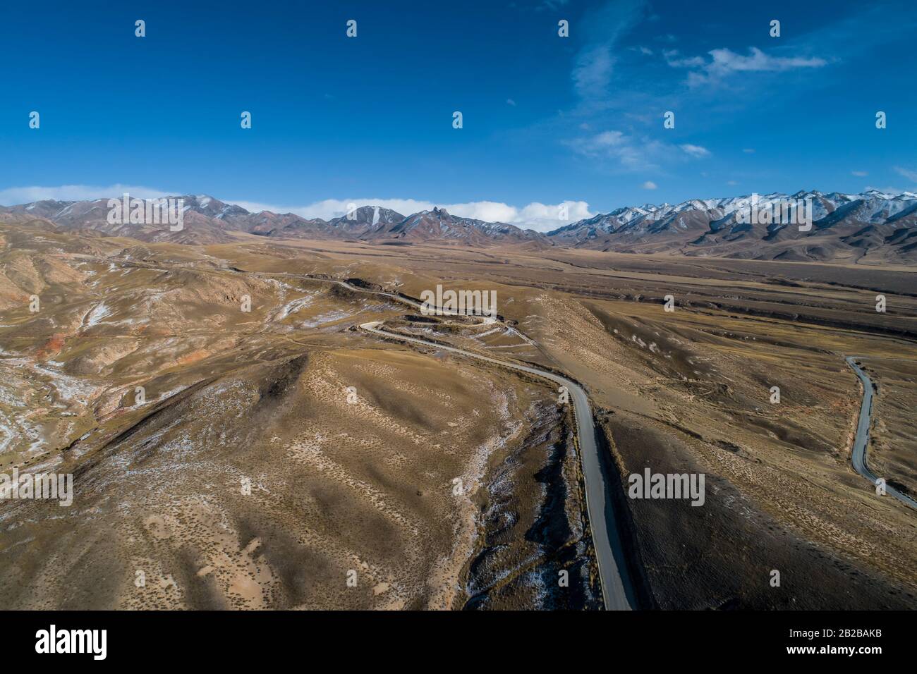 aerial view of the curved Qilian mountain road Stock Photo