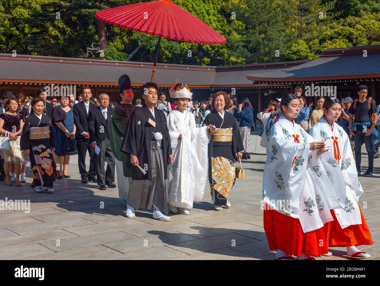 Tokyo, Japan, ?Priests, spouses, relatives and guests in procession for a traditional marriage ceremony in the Meiji Juku temple Stock Photo