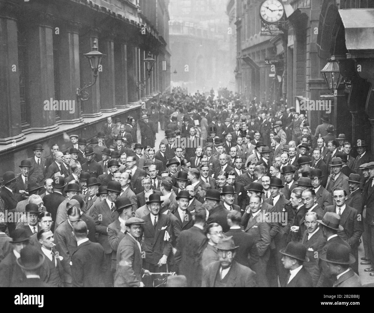 The Great Depression in Great Britain: People trade on the streets, after the stock exchange is closed the second day. Stock Photo