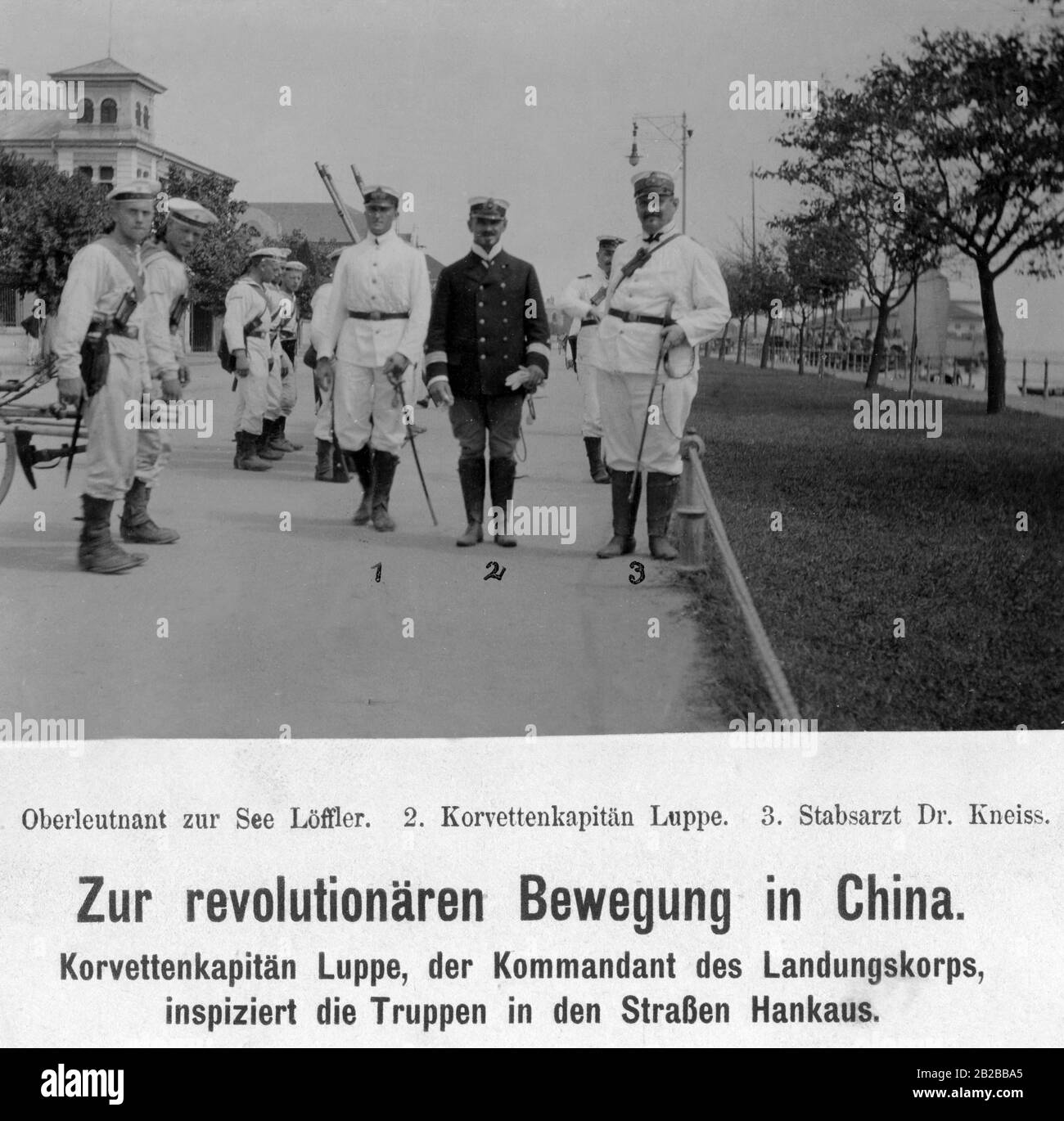 Lieutenant Loeffler (left), Lieutenant-Commander Luppe (center) and medical officer dr. Kneiss inspect the troop in the German colony in Hankou in China, during the Chinese Revolution. Stock Photo