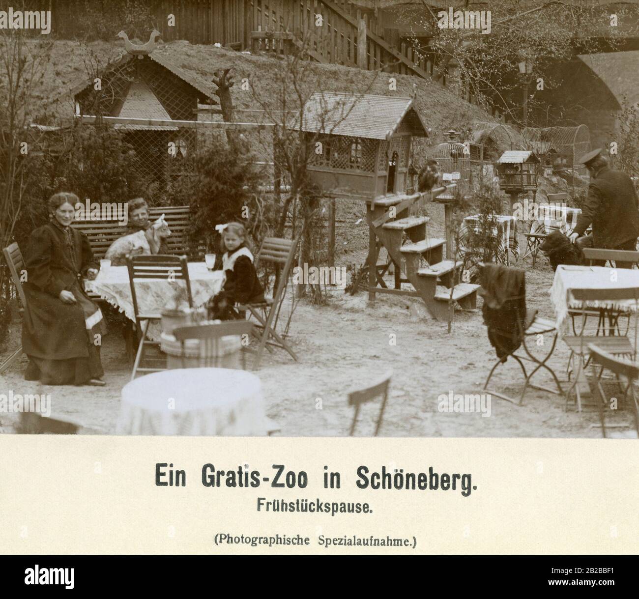 A family having breakfast at the free zoo in Schoeneberg. Stock Photo
