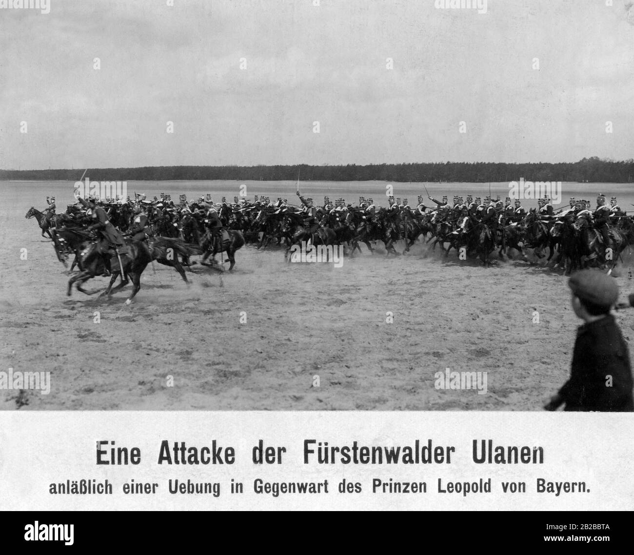 An attack of the Fuerstenwalde Uhlan regiment during an exercise in the presence of Prince Leopold of Bavaria. Stock Photo